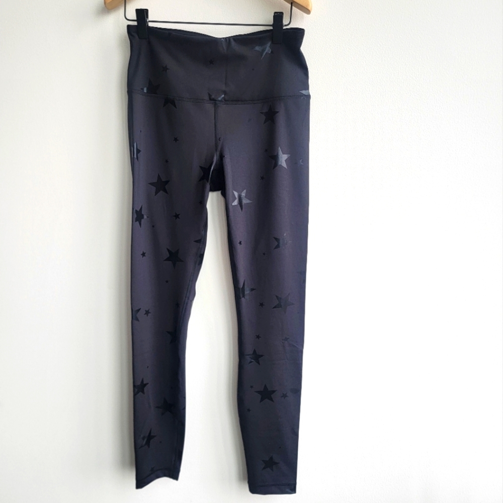 Black with black shiny star 90 degree reflex leggings size M. Never worn